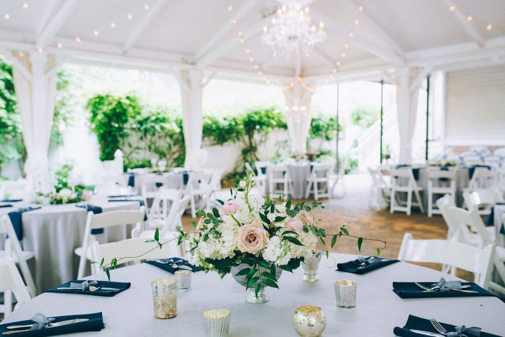 Silver, navy and blush table setup for reception at Nashville garden wedding venue